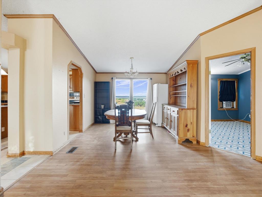381 West McCool Road Nocona, TX 76255 - Photo 15 of 39 a living room with furniture and a large window