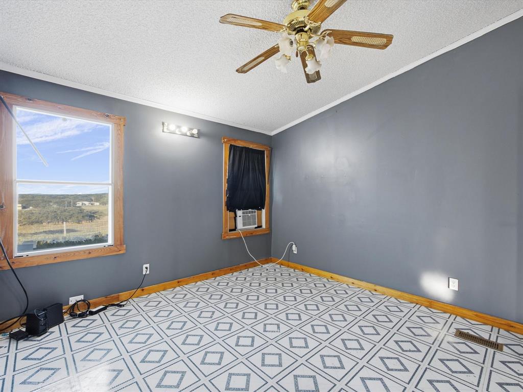 381 West McCool Road Nocona, TX 76255 - Photo 20 of 39 a view of an empty room and window