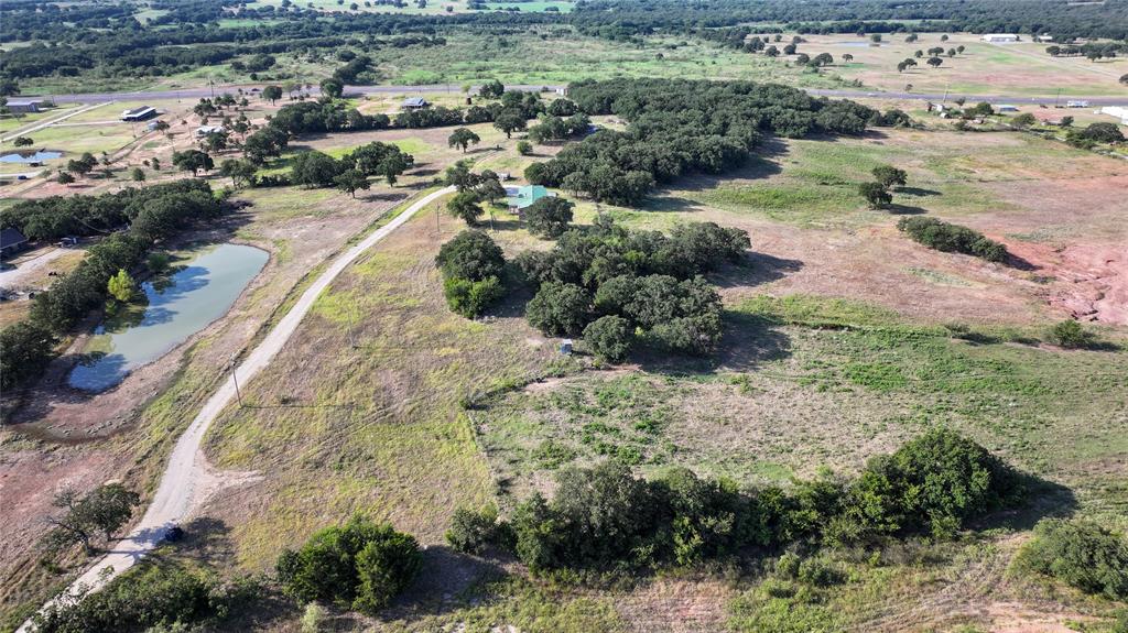 381 West McCool Road Nocona, TX 76255 - Photo 2 of 39 an aerial view of residential houses with outdoor space