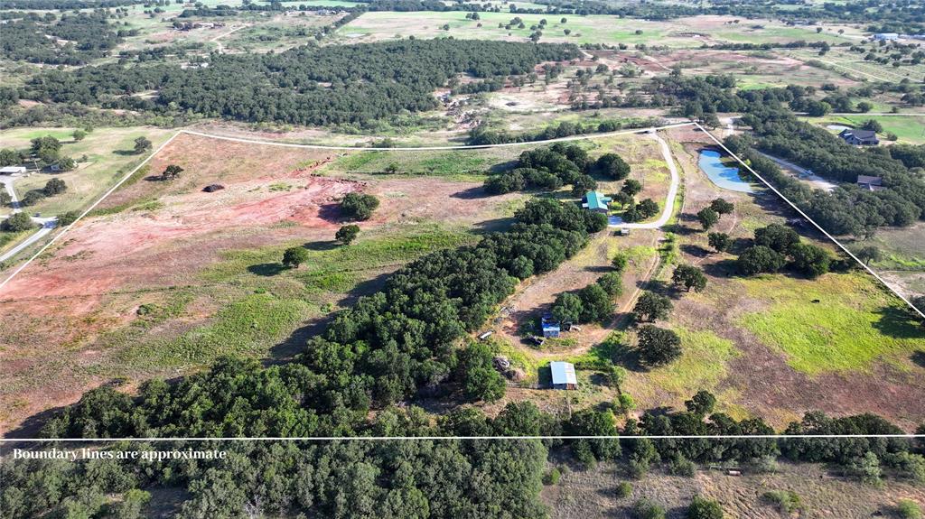 381 West McCool Road Nocona, TX 76255 - Photo 28 of 39 an aerial view of lake residential houses with outdoor space and swimming pool