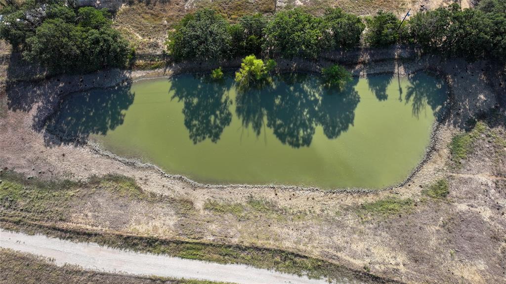 381 West McCool Road Nocona, TX 76255 - Photo 31 of 39 a view of a lake from a yard