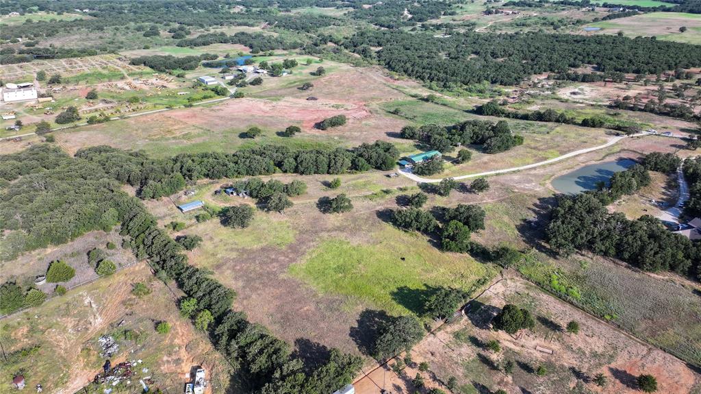 381 West McCool Road Nocona, TX 76255 - Photo 32 of 39 an aerial view of a house with a yard