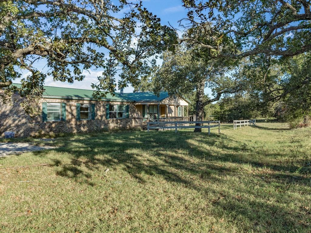 381 West McCool Road Nocona, TX 76255 - Photo 38 of 39 a front view of a house with a yard
