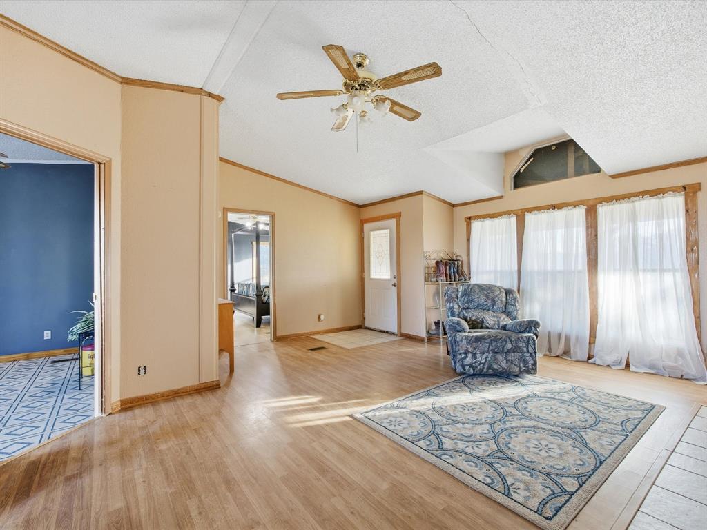 381 West McCool Road Nocona, TX 76255 - Photo 6 of 39 a living room with furniture and a large window