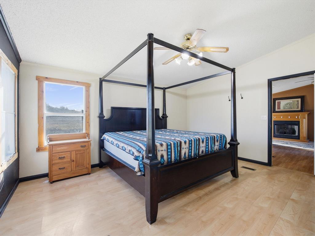 381 West McCool Road Nocona, TX 76255 - Photo 7 of 39 a bedroom with a bed and a window