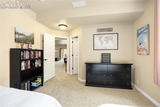 1131 Old North Gate Road Colorado Springs, CO 80921 - Photo 31 of 39 Carpeted bedroom with baseboards