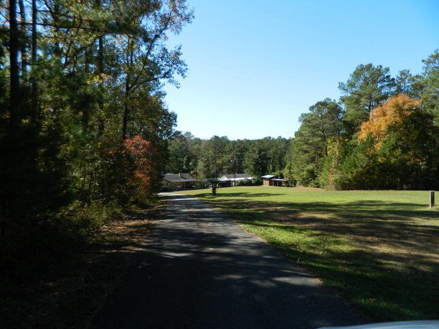 426 Huckabee Road Gray, GA 31032 - Photo 3 of 40 a view of a golf course with a lake