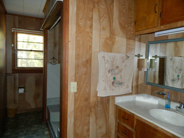 426 Huckabee Road Gray, GA 31032 - Photo 29 of 40 a bathroom with a sink and a mirror