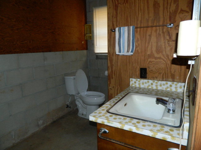 426 Huckabee Road Gray, GA 31032 - Photo 34 of 40 a bathroom with a granite countertop sink a toilet and bathtub