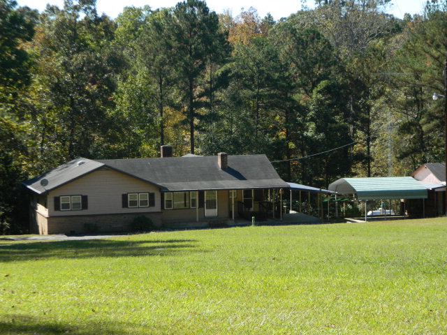 426 Huckabee Road Gray, GA 31032 - Photo 40 of 40 a front view of a house with yard and green space