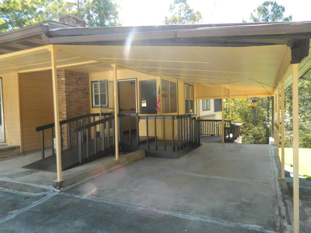 426 Huckabee Road Gray, GA 31032 - Photo 9 of 40 a view of a porch with furniture
