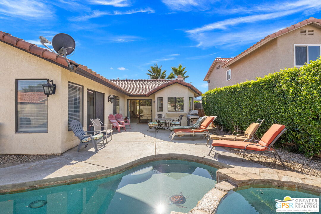 45688 Sutter Creek Road Indio, CA 92201 - Photo 38 of 51 a outdoor space with pool and furniture