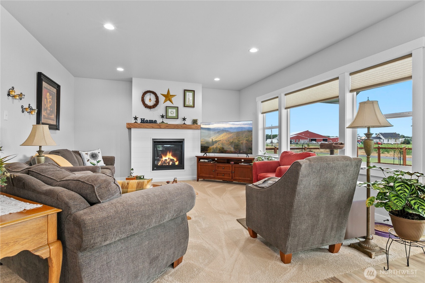 2068 Bowfin Way Lynden, WA 98264 - Photo 9 of 35 a living room with furniture and a fireplace