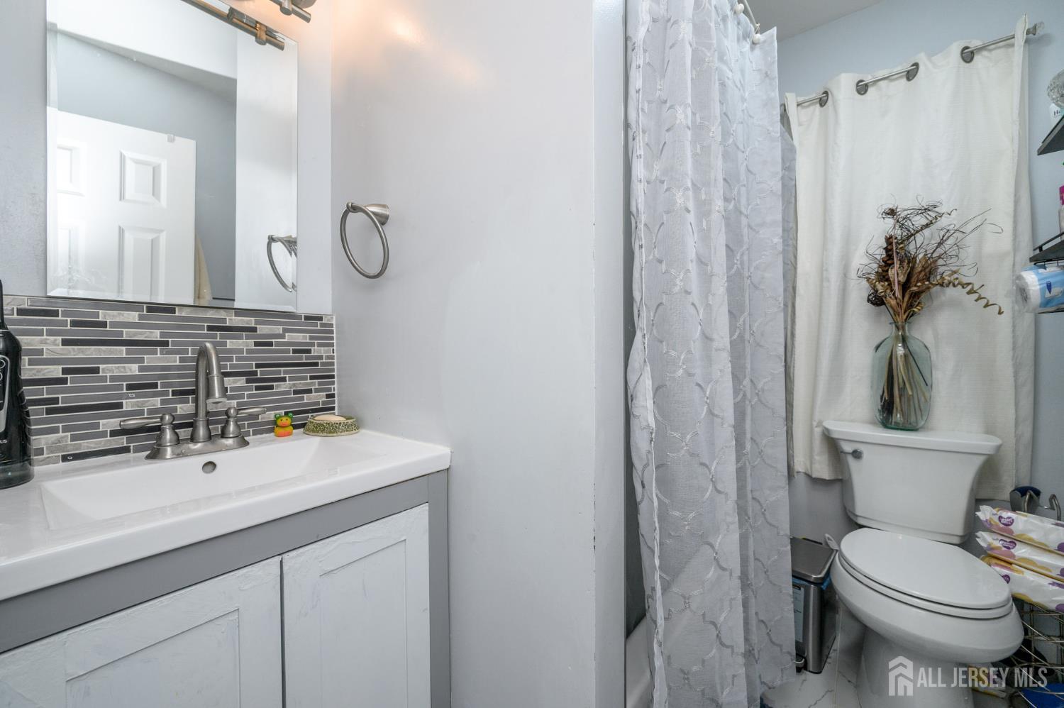 2309 South Cuthbert Drive Lindenwold, NJ 08021 - Photo 27 of 34 a bathroom with a sink a toilet and shower