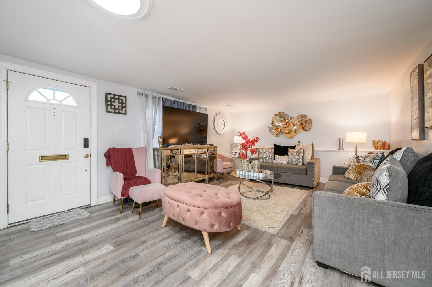 2309 South Cuthbert Drive Lindenwold, NJ 08021 - Photo 4 of 34 a living room with furniture and a flat screen tv