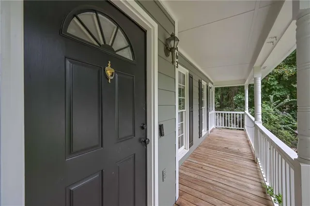 a view of balcony with wooden floor