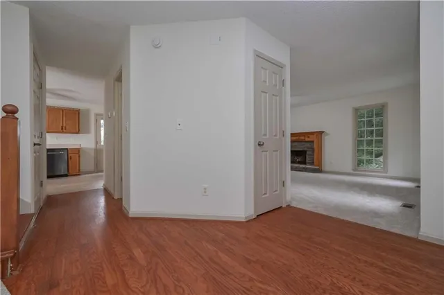 wooden floor in an empty room and a window