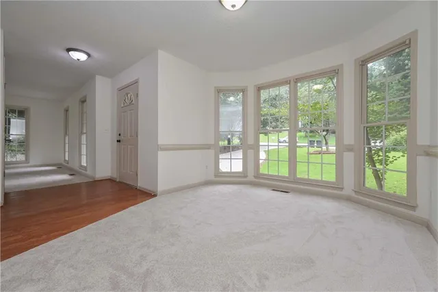 a view of an empty room with a window