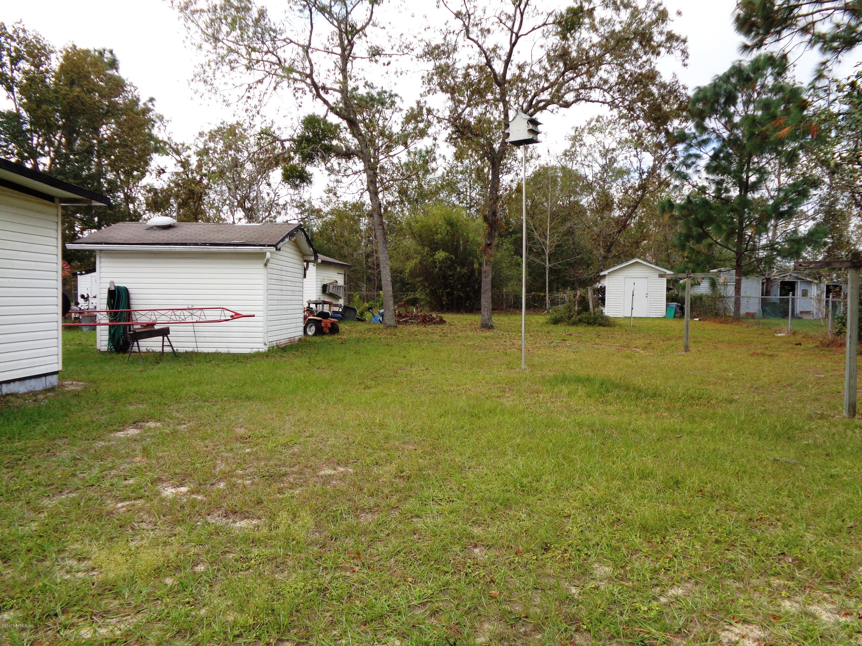 137 Istanbul Street Interlachen, FL 32148 - Photo 12 of 18 a view of a house with backyard