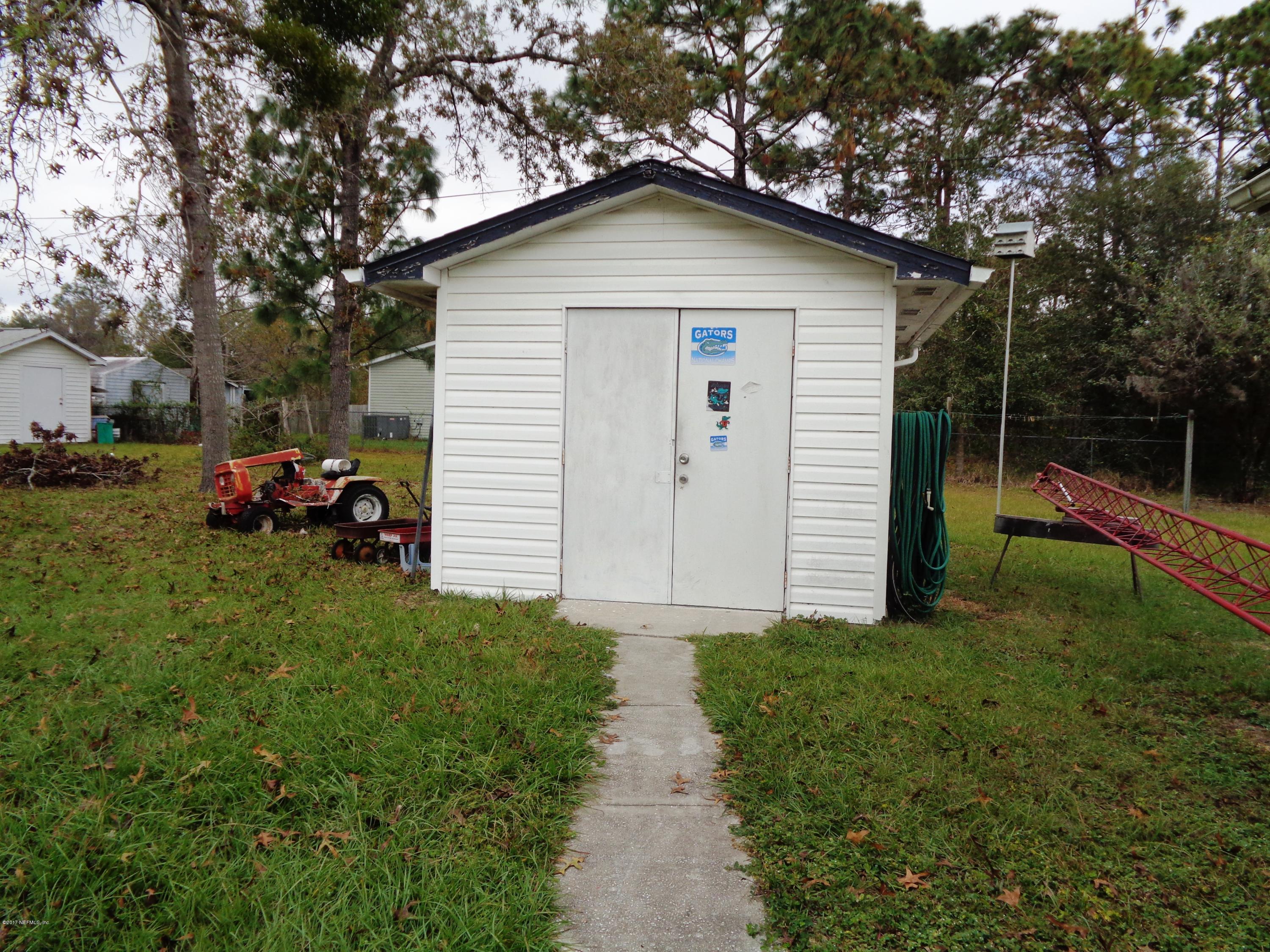 137 Istanbul Street Interlachen, FL 32148 - Photo 14 of 18 a view of a house with a yard