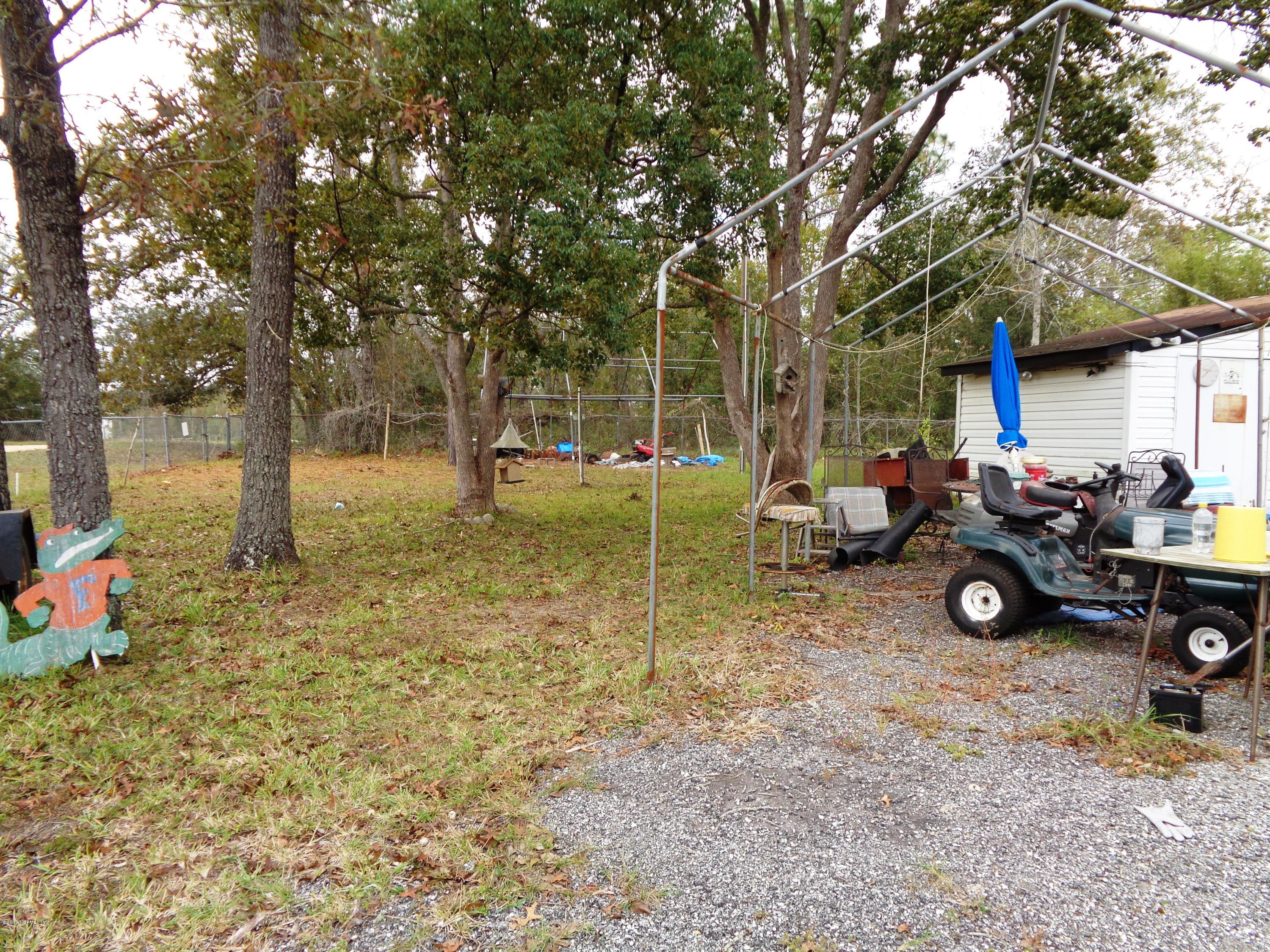 137 Istanbul Street Interlachen, FL 32148 - Photo 15 of 18 a view of a house with a backyard space and sitting area