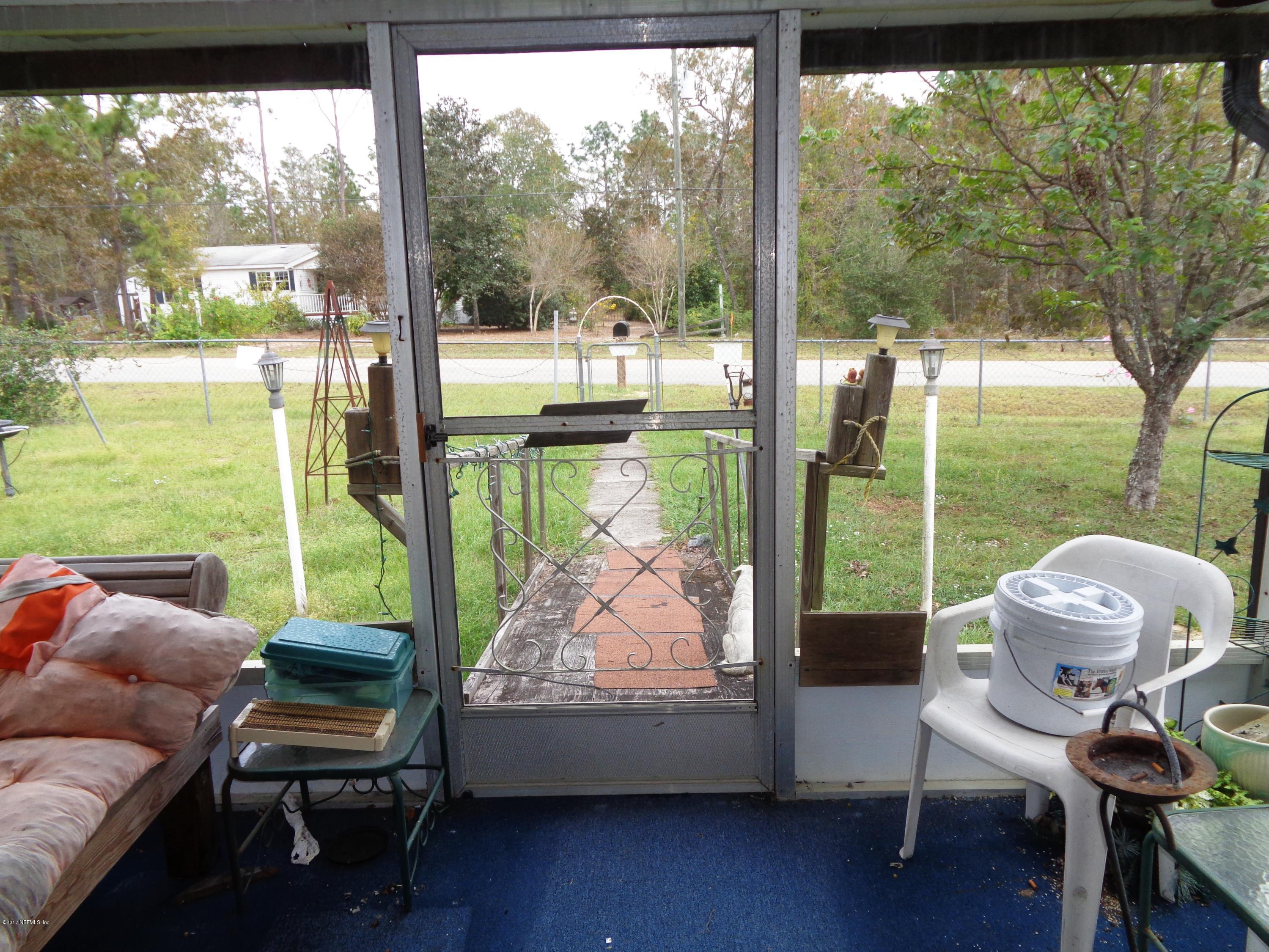 137 Istanbul Street Interlachen, FL 32148 - Photo 18 of 18 a bedroom with furniture and a large window