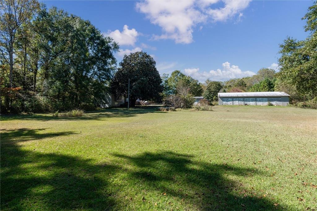5300 Macland Road Powder Springs, GA 30127 - Photo 9 of 11 a view of outdoor space with swimming pool and green space