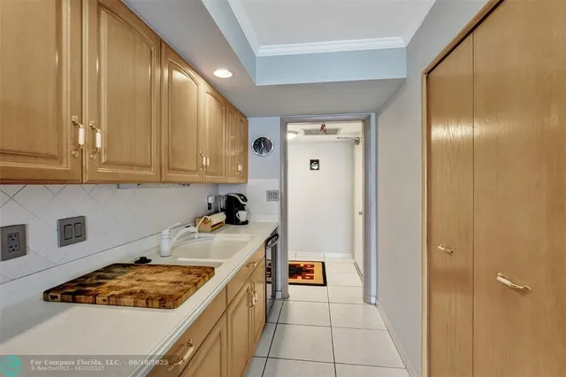 a kitchen with a stove and a refrigerator