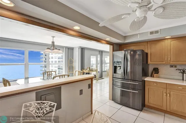 a kitchen with a sink and refrigerator