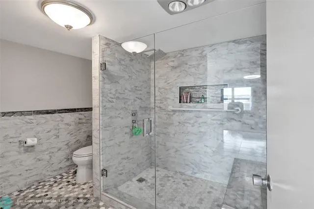 a bathroom with a shower and a toilet