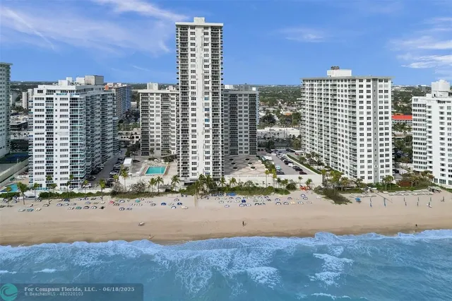 a view of a backyard with sitting area