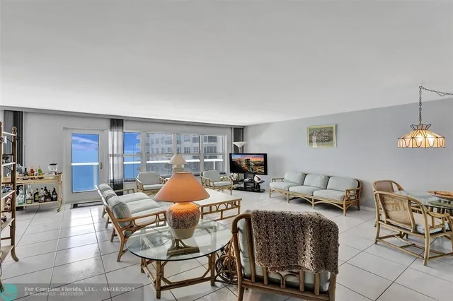 a living room with furniture and a lamp