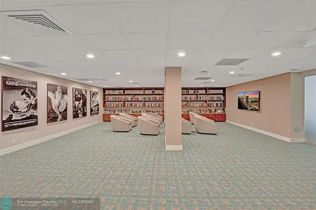 a lobby with furniture and rug