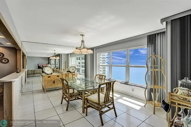 a view of a dining room with furniture window and outside view
