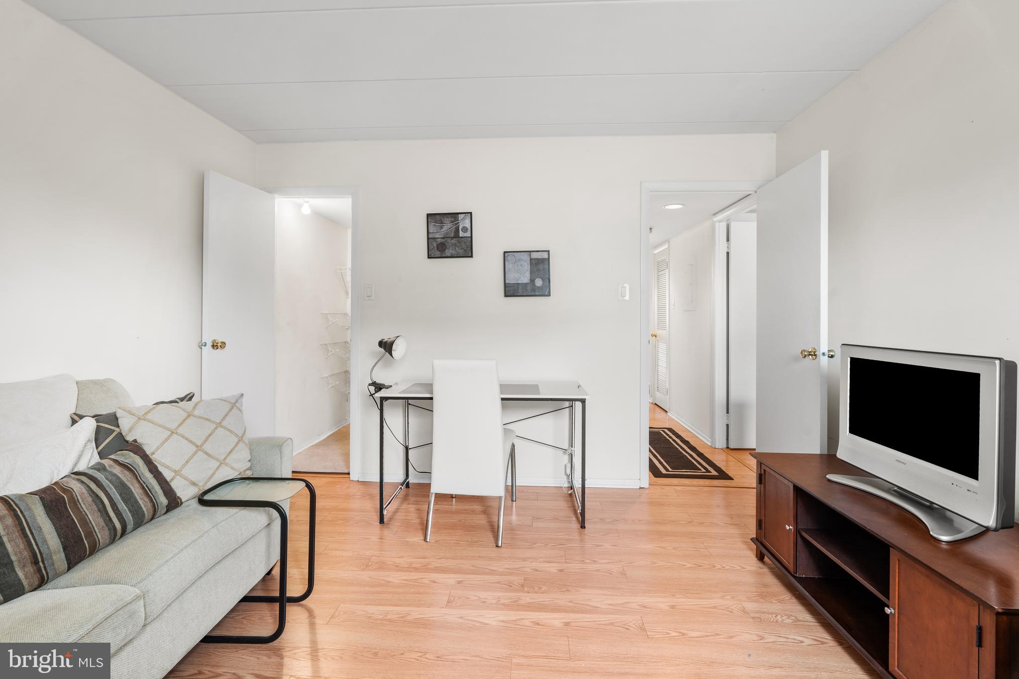 9945 Norwalk Road, Unit 15A Philadelphia, PA 19115 - Photo 20 of 23 a living room with furniture and a flat screen tv