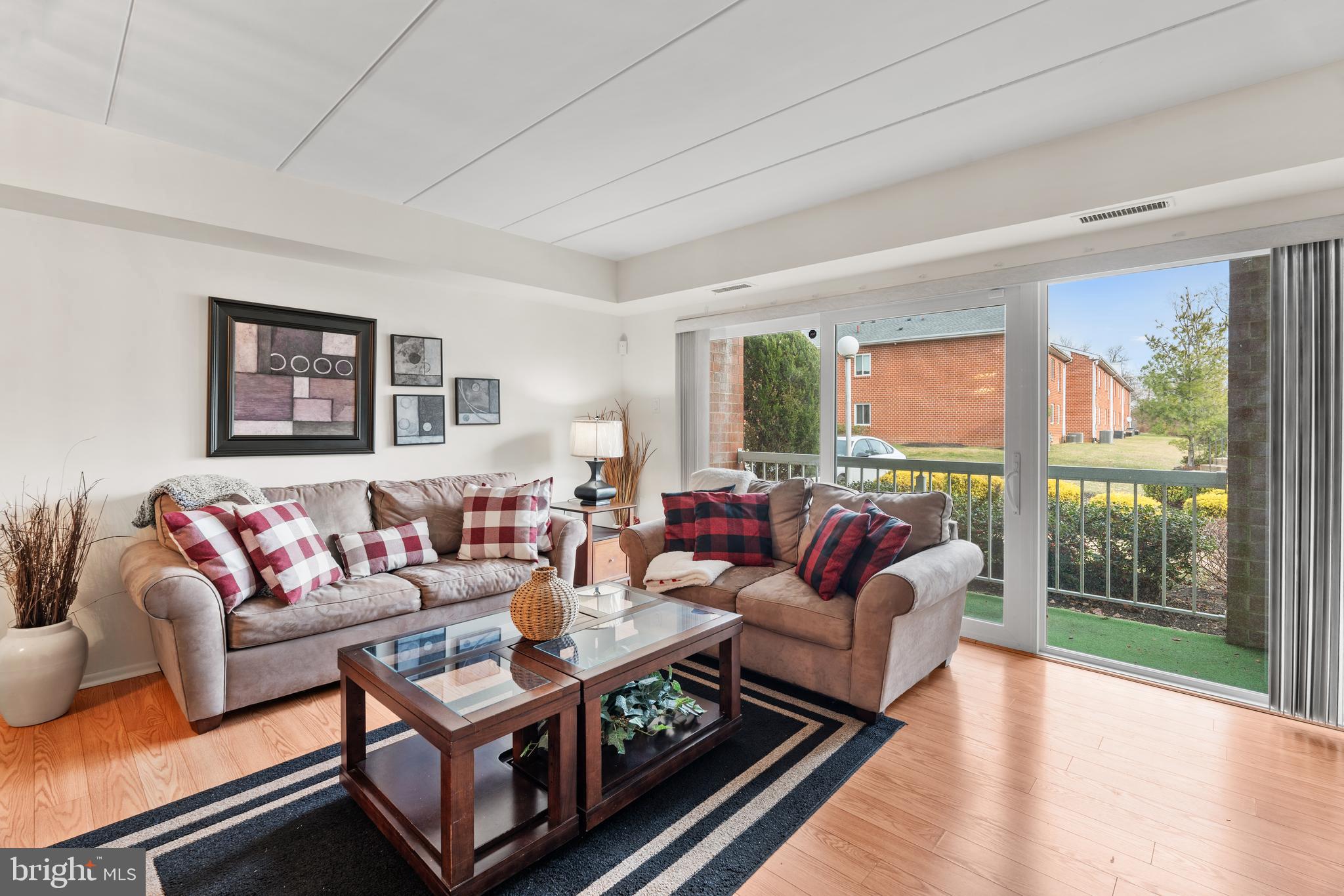 9945 Norwalk Road, Unit 15A Philadelphia, PA 19115 - Photo 2 of 23 a living room with furniture and a large window
