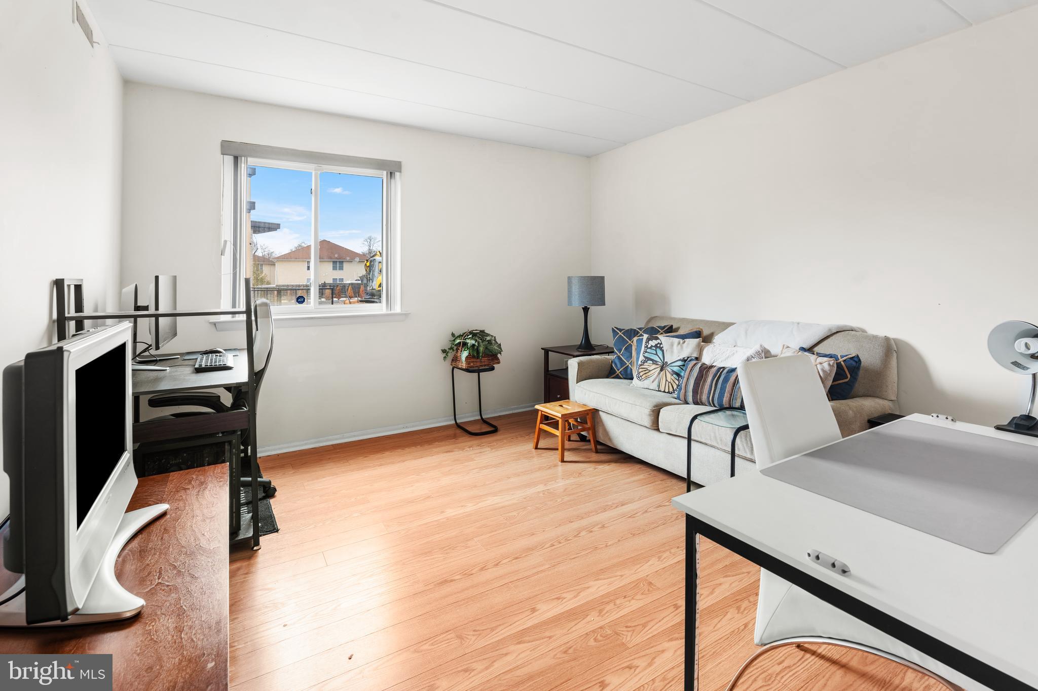 9945 Norwalk Road, Unit 15A Philadelphia, PA 19115 - Photo 21 of 23 a bedroom with furniture and a window