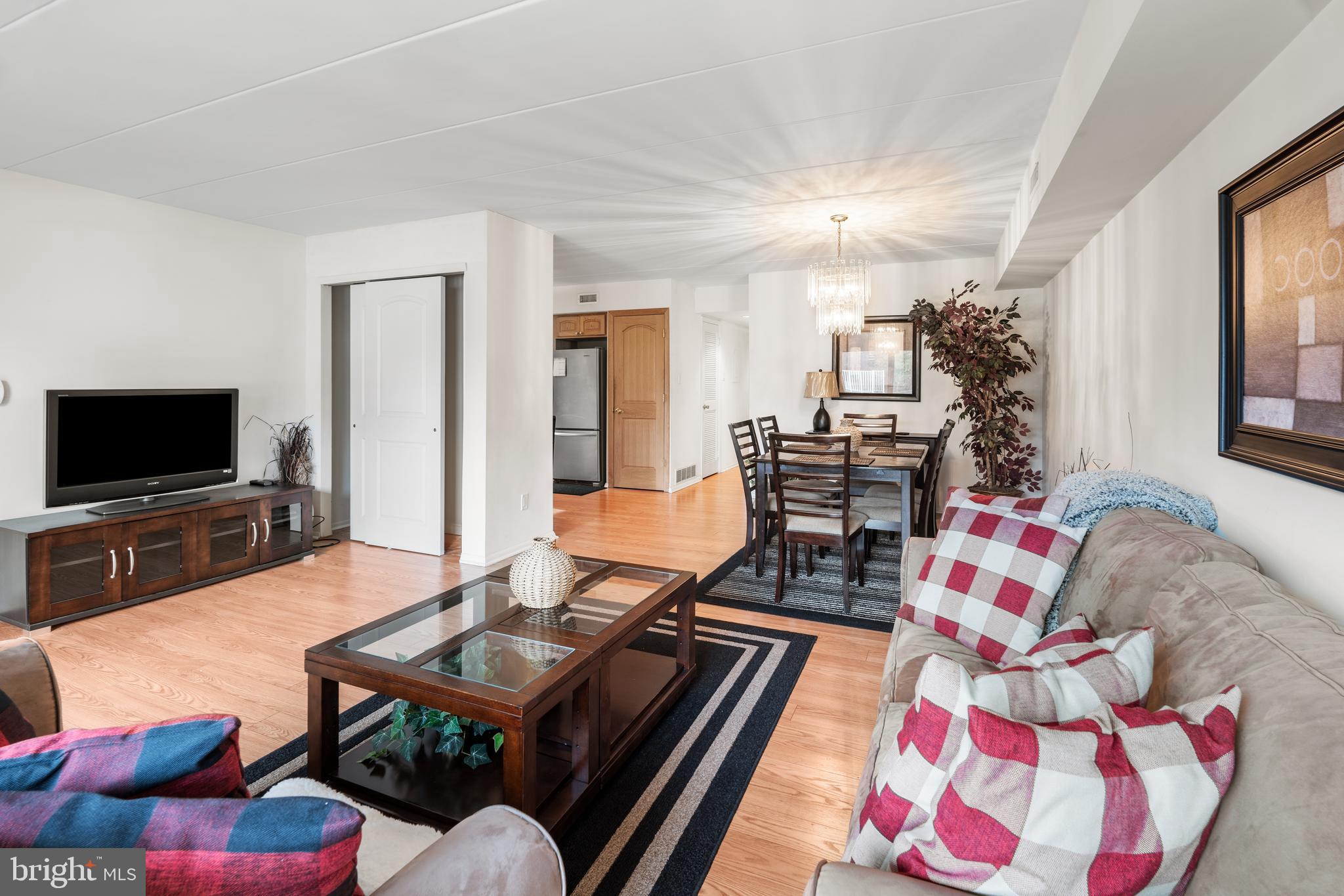 9945 Norwalk Road, Unit 15A Philadelphia, PA 19115 - Photo 5 of 23 a living room with furniture and flat screen tv