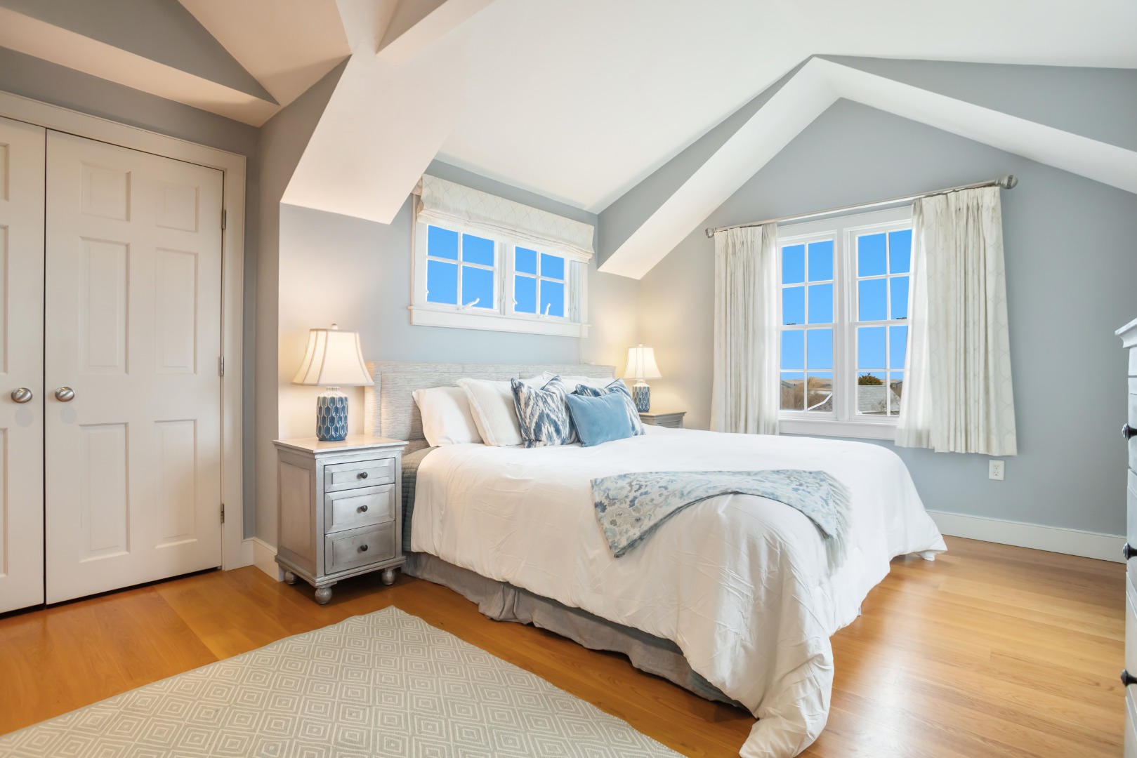 5 Tautemo Way Nantucket, MA 02554 - Photo 22 of 30 a spacious bedroom with a bed and a window