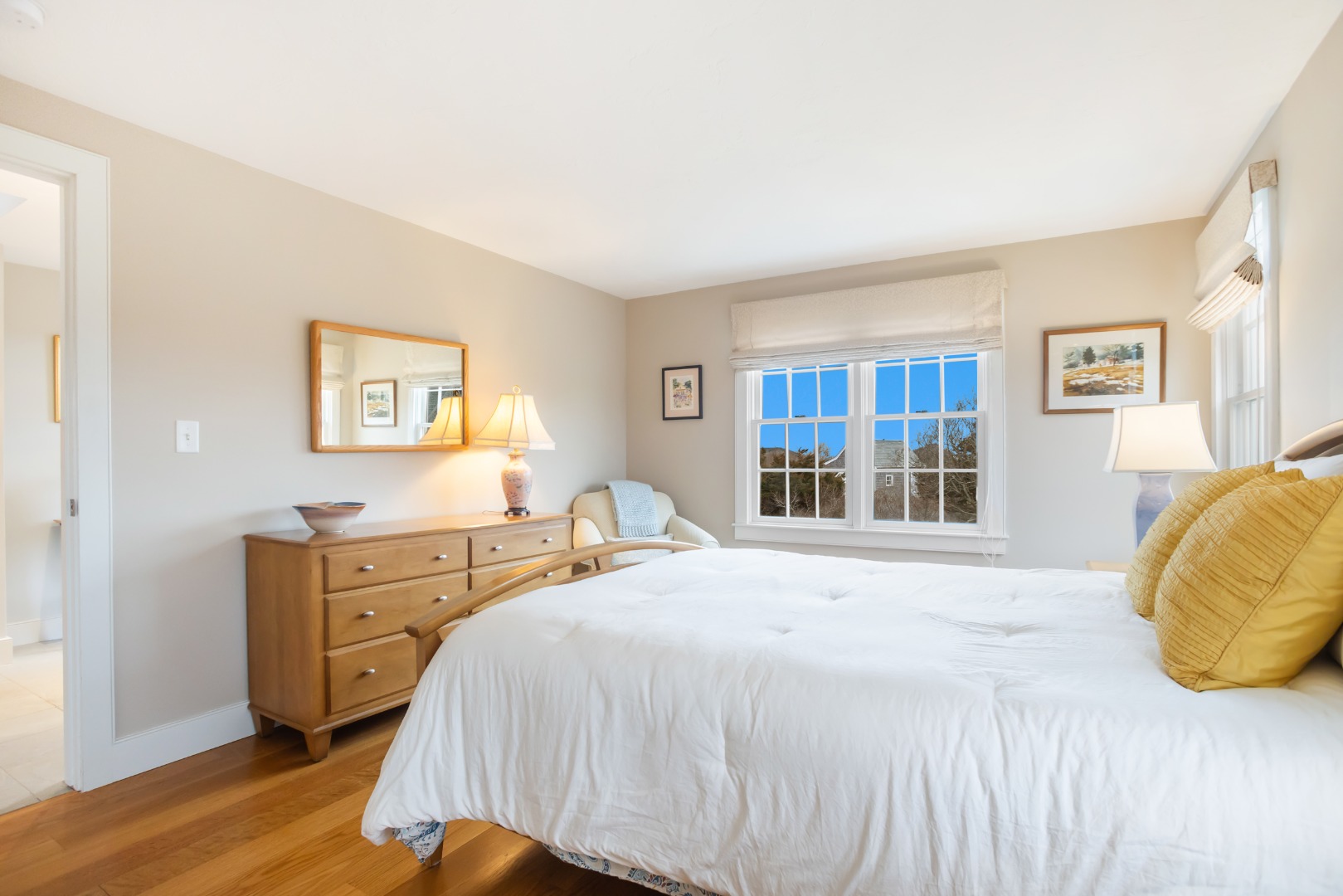 5 Tautemo Way Nantucket, MA 02554 - Photo 24 of 30 a bedroom with a bed and wooden floor