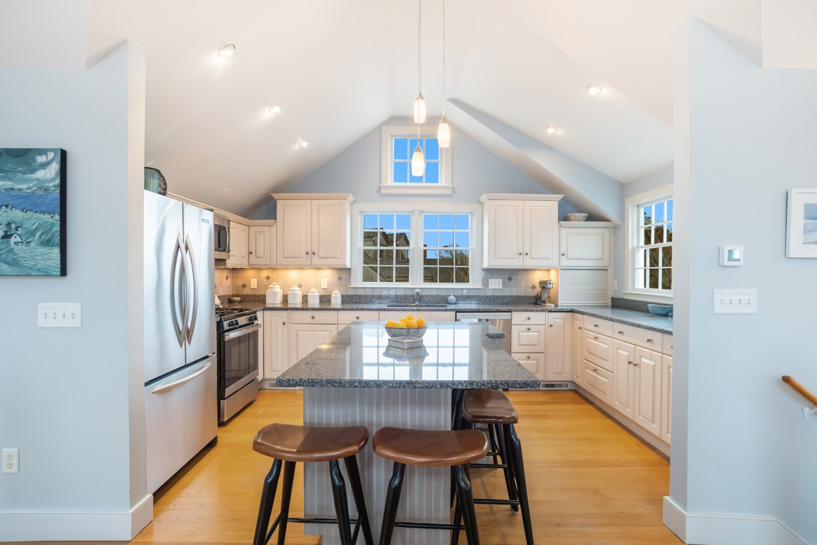 5 Tautemo Way Nantucket, MA 02554 - Photo 7 of 30 a kitchen with stainless steel appliances granite countertop a refrigerator a sink dishwasher a stove and white cabinets with wooden floor