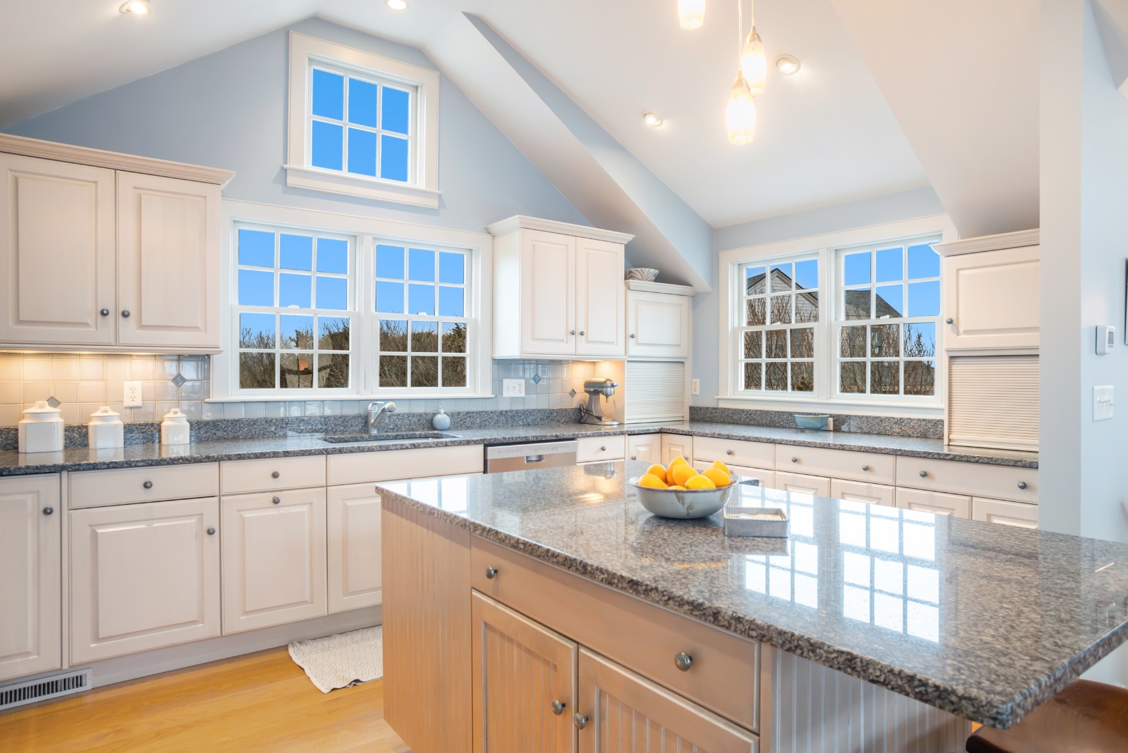 5 Tautemo Way Nantucket, MA 02554 - Photo 8 of 30 a kitchen with a sink stove and cabinets