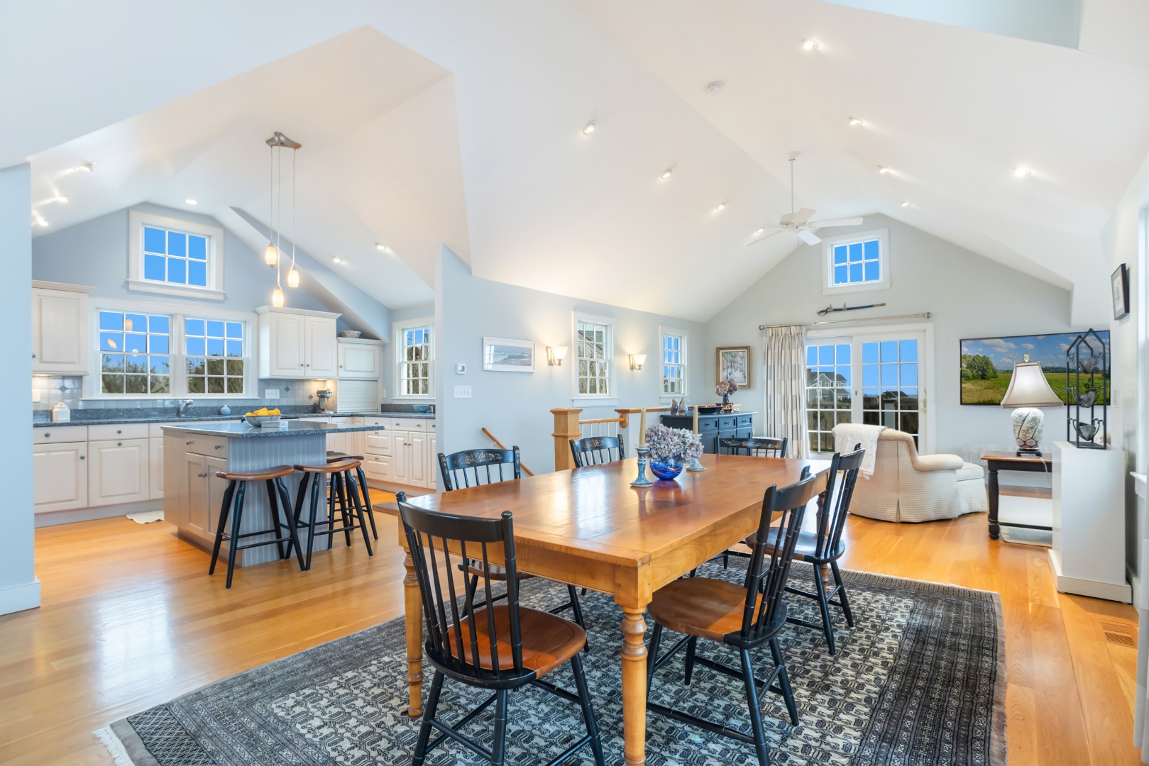 5 Tautemo Way Nantucket, MA 02554 - Photo 10 of 30 a dining room with stainless steel appliances a table and chairs