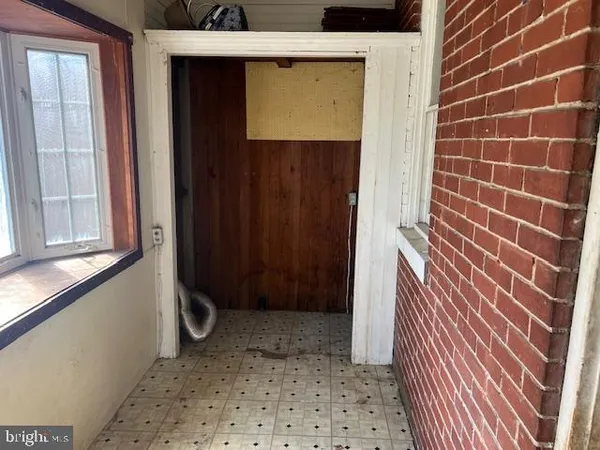 a view of a door and a window