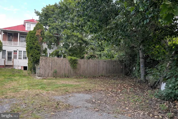 a view of backyard with green space