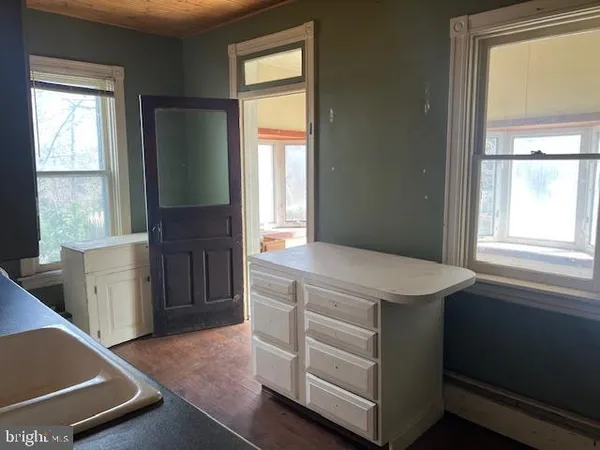 a room with cabinets and a window