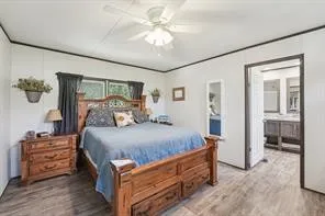 a bed room with a bed and a chandelier