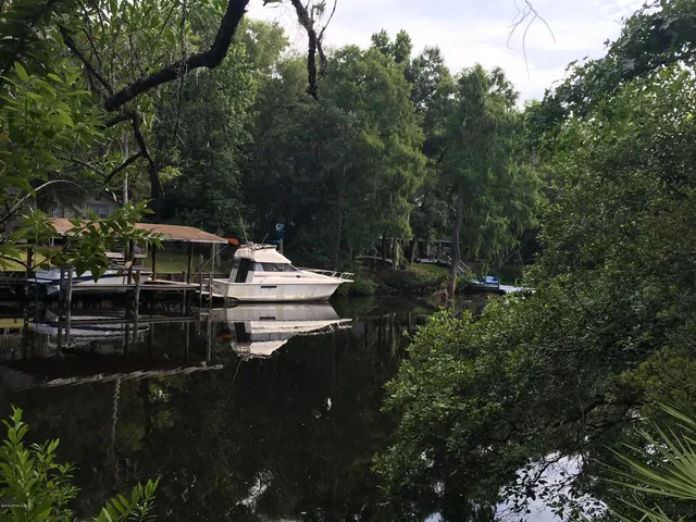 a backyard of a house with lots of green space