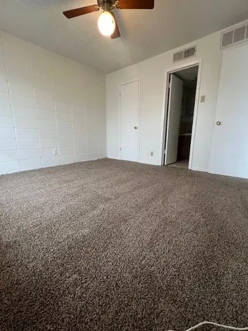 an empty room with a mirror