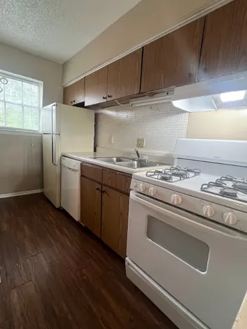 a kitchen with stainless steel appliances a stove and a refrigerator